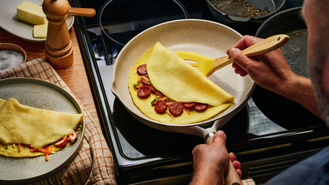 Making omelettes - folding over plain omelette using a large